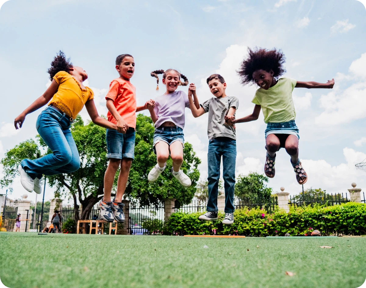 Children leaping in the park